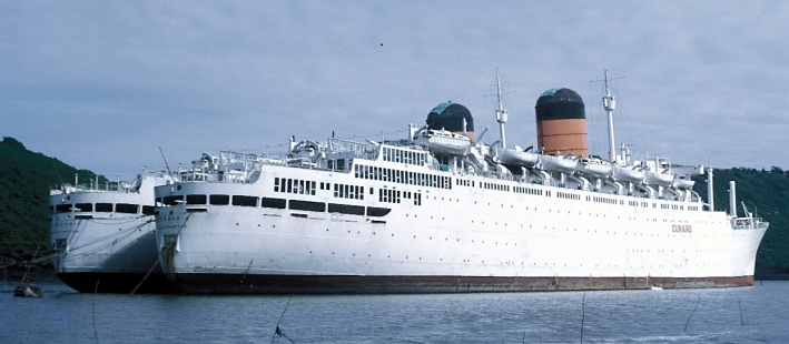 Carmania (II) docked alongside the Franconia (III) on River Fal, Cornwall, in 1971 awaiting purchase